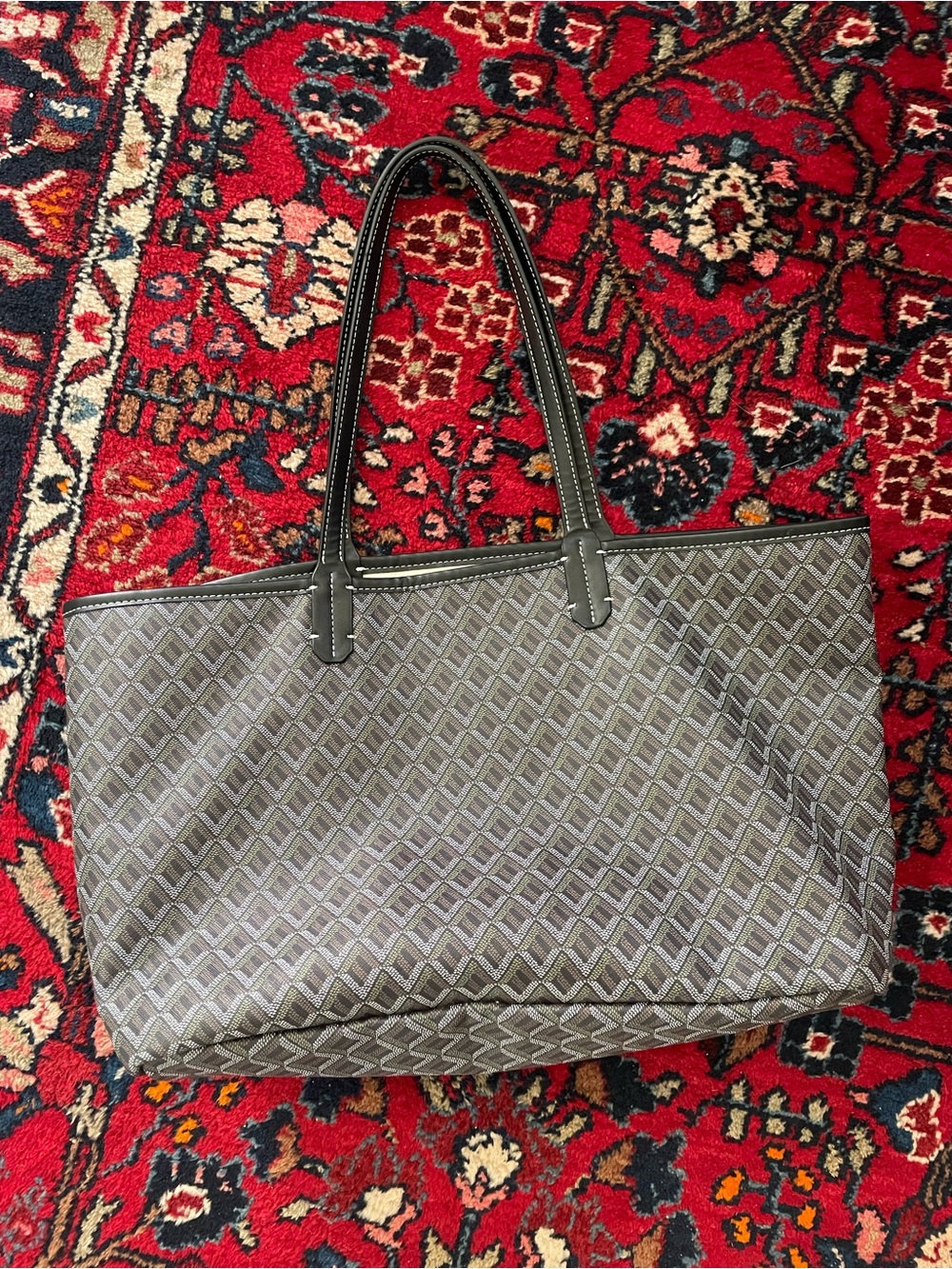 Black tote with a touch of green and brown
